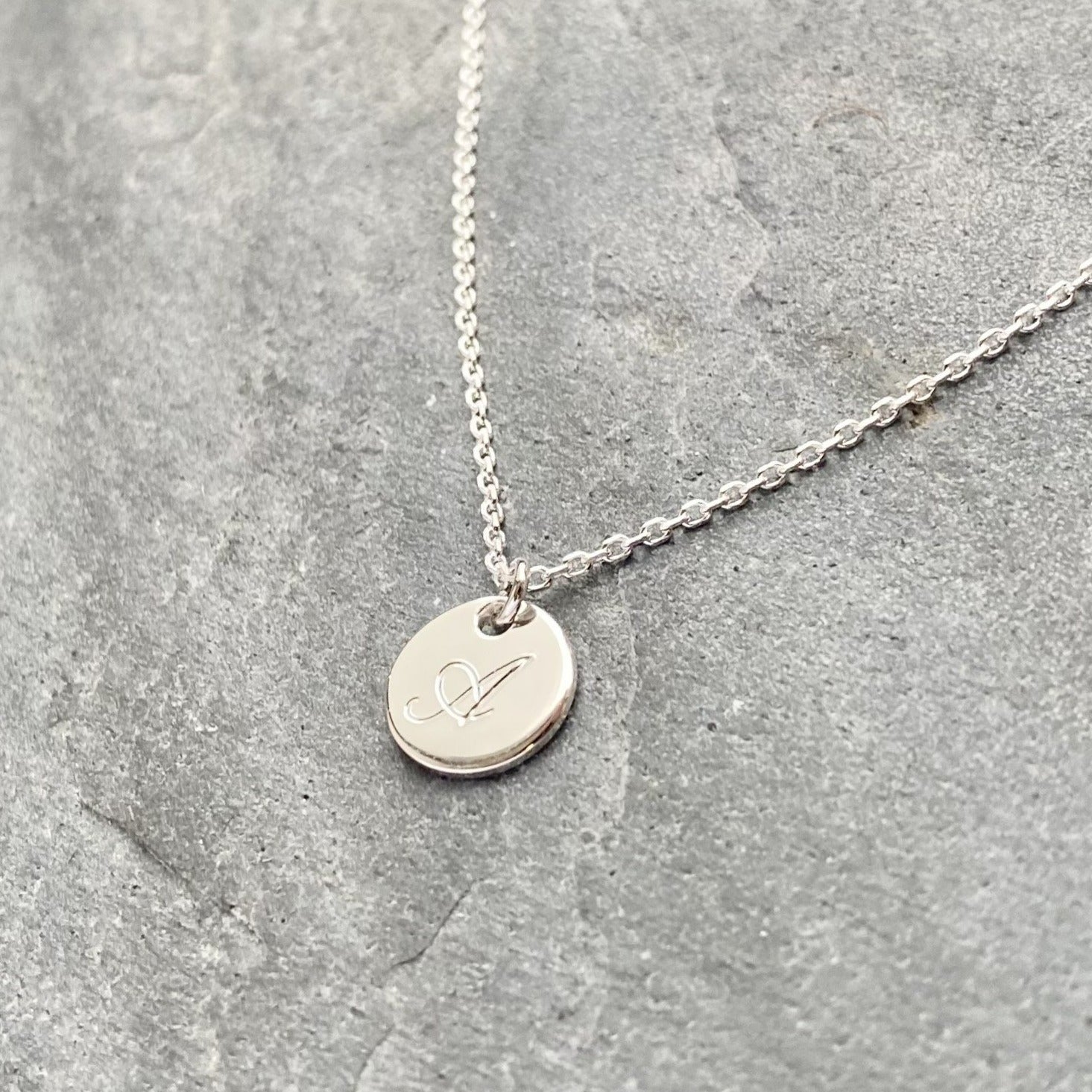 Silver necklace deals with initial discs